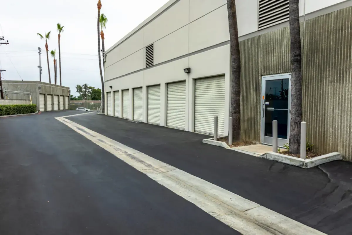An aisle of exterior storage units at Garden Grove Secured Storage